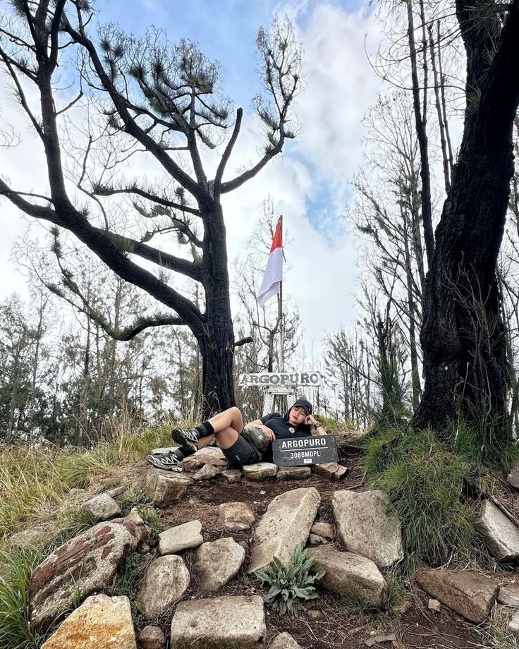 Ancient temple ruins and sunrise view from Rengganis Peak on the Mount Argopuro trail