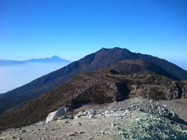Mount Arjuno-Welirang in East Java offers a twin volcano adventure with scenic trails, sulfur mining craters, and panoramic summit views near Tretes.