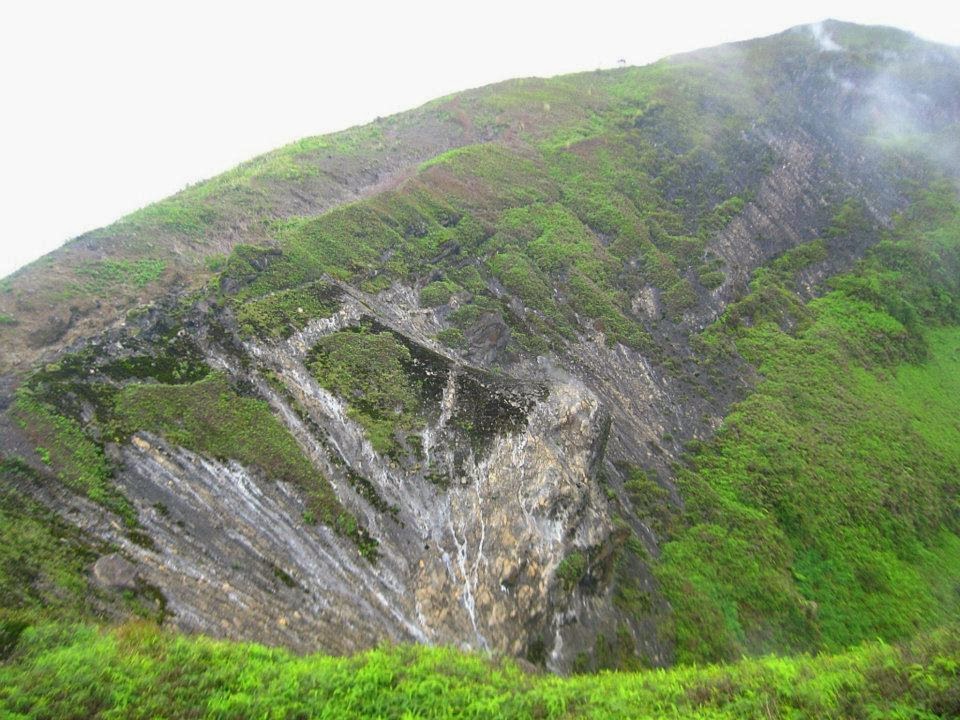 Steep volcanic slope near Watu Gede camp with Mount Lemongan’s summit in the background