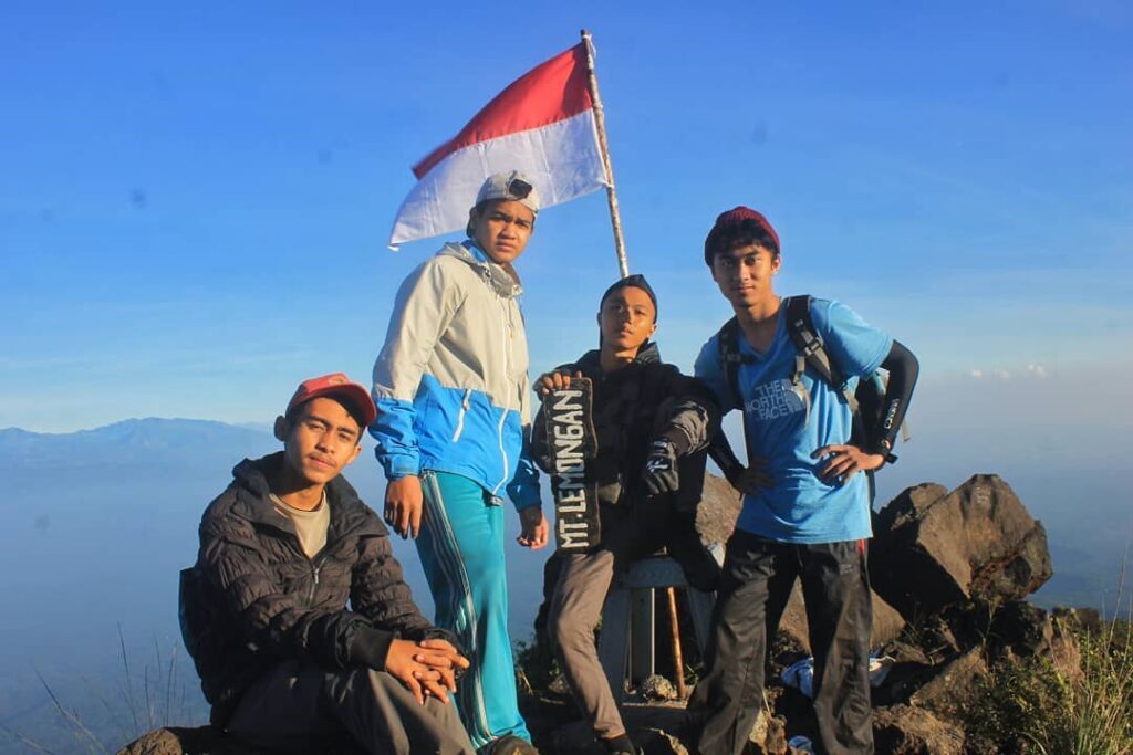 Trailhead entrance to Mount Lemongan with hikers preparing for ascent near Papringan village